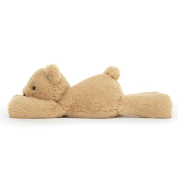 Peluche ours couché