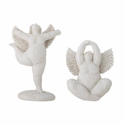 Set de statuette femmes avec ailes devant un fond blanc 