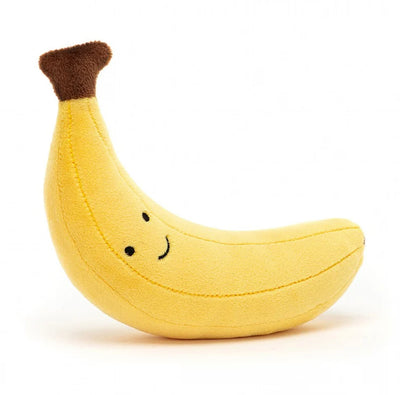 Peluche banane devant un fond blanc 