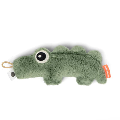 Hochet crocodile devant fond blanc