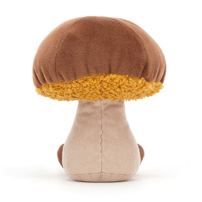 Peluche champignon de dos devant un fond blanc 